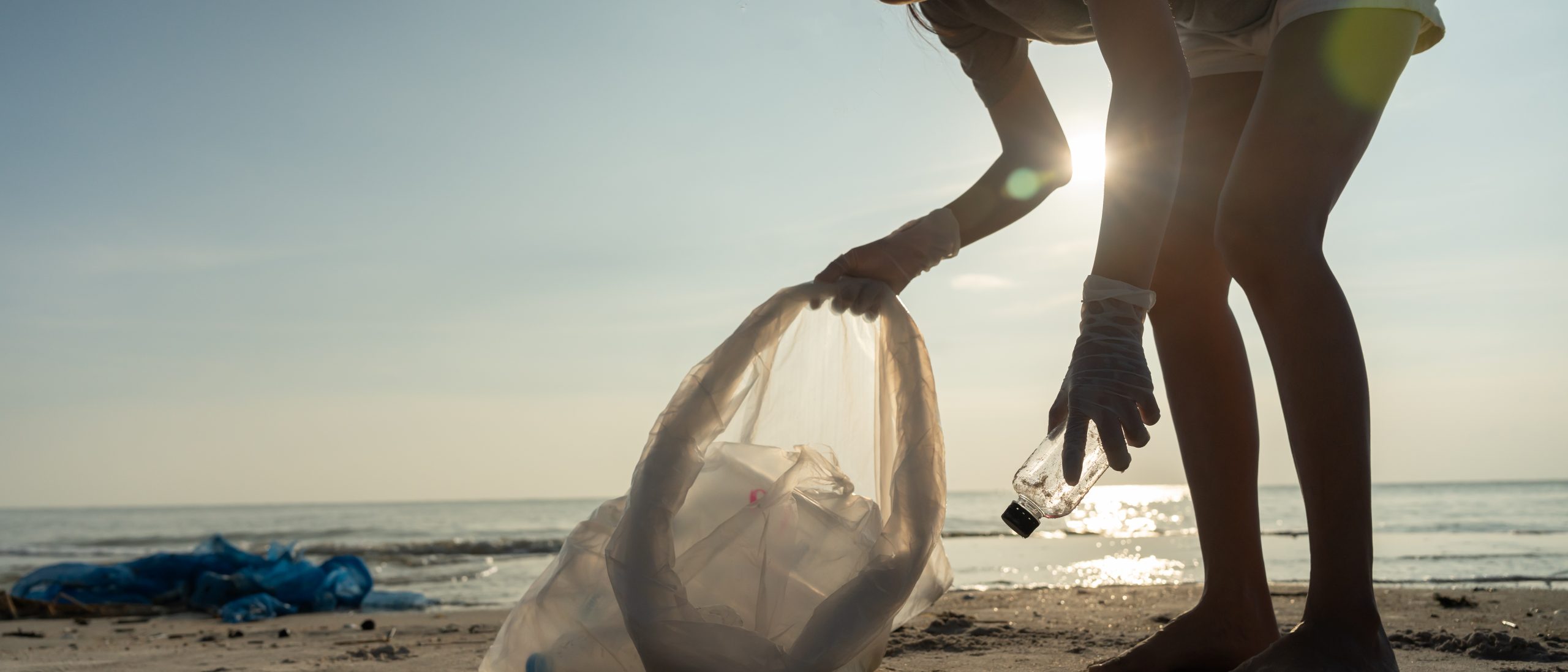 Save ocean. Volunteer pick up trash garbage at the beach and pla